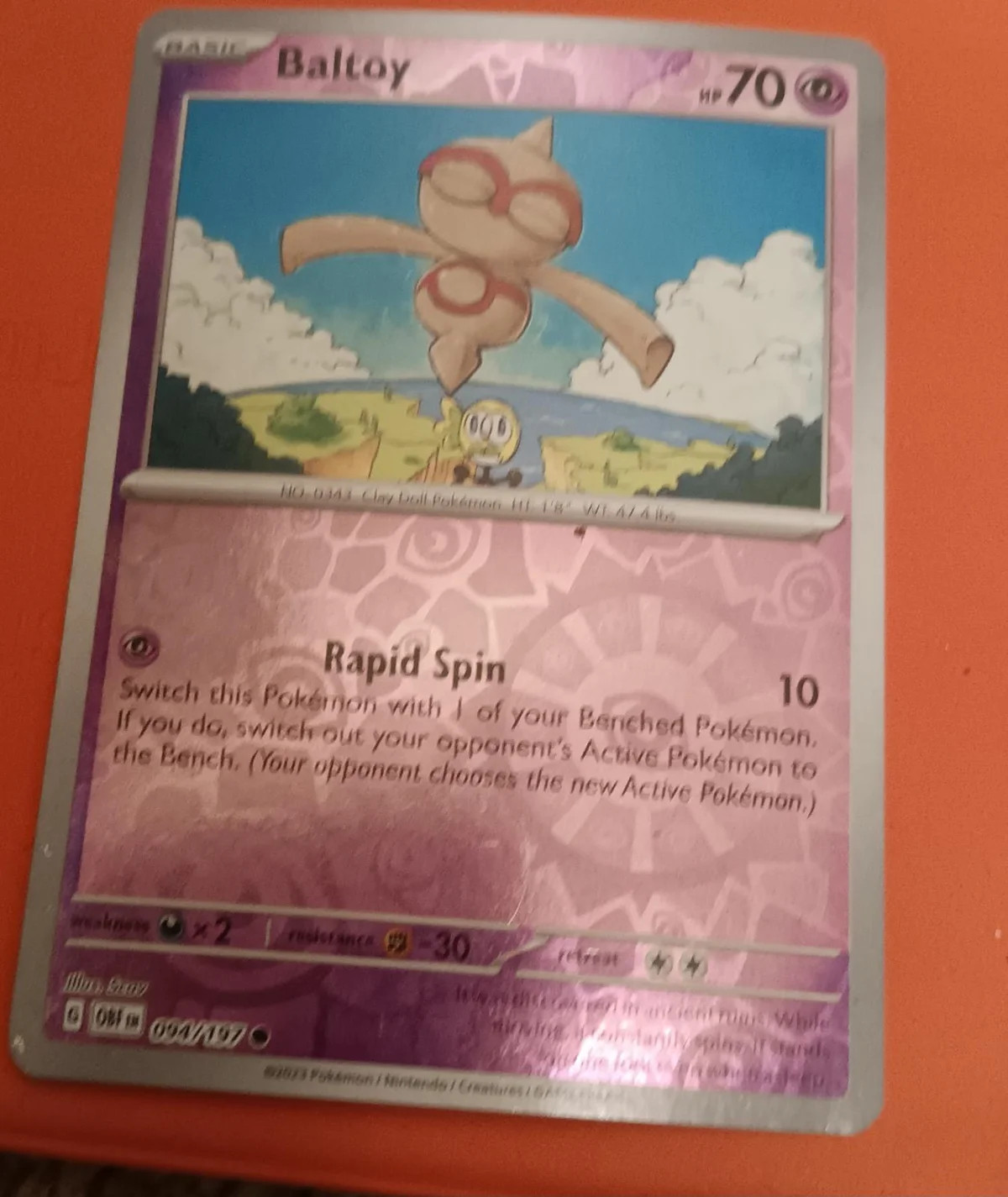 Baltoy #094 — Llamas Obsidianas (Reverse Holo)