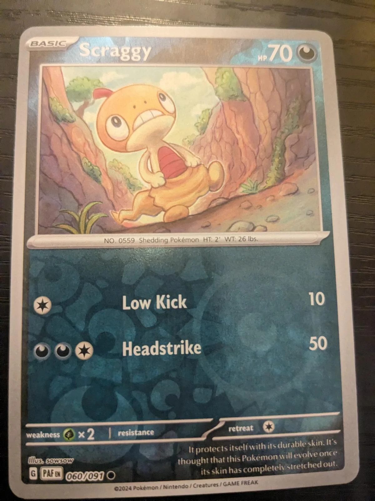 Scraggy #060 — Destinos de Paldea (Reverse Holo)