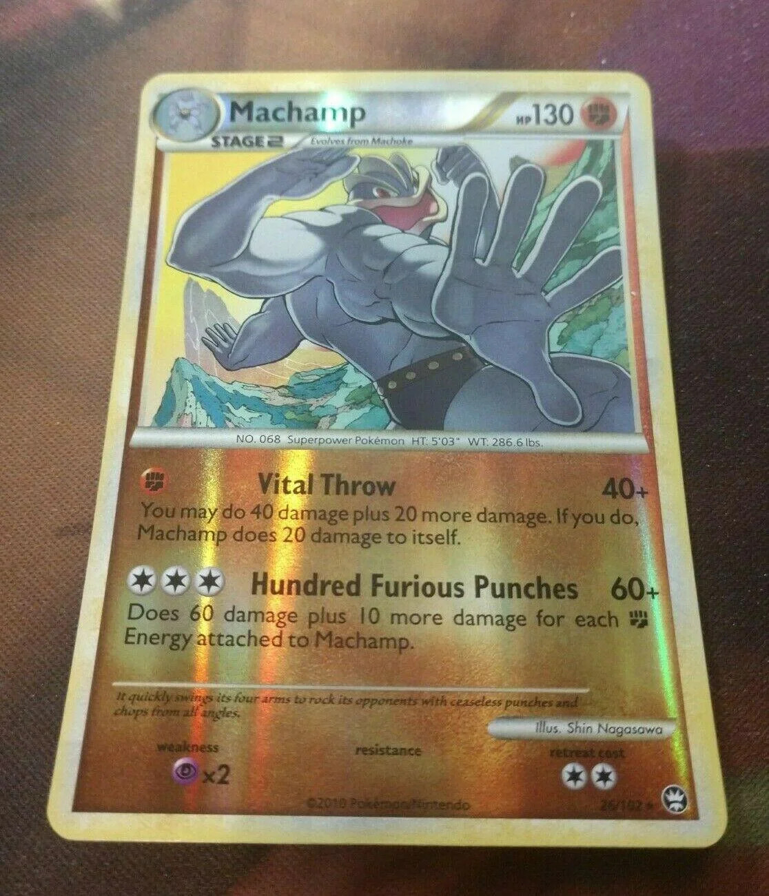 Machamp #26 — Battaglie Trionfali (Reverse Holo)