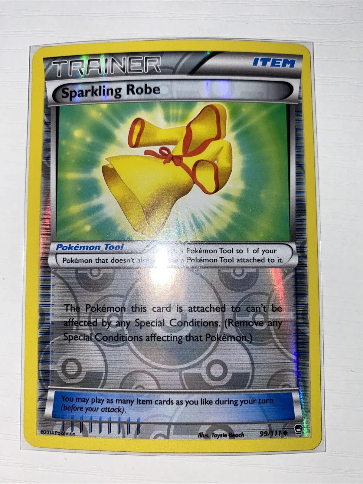Veste Cintilante #99 — Punhos Furiosos (Reverse Holo)
